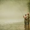 Two men fly fishing on Watauga River in North Carolina