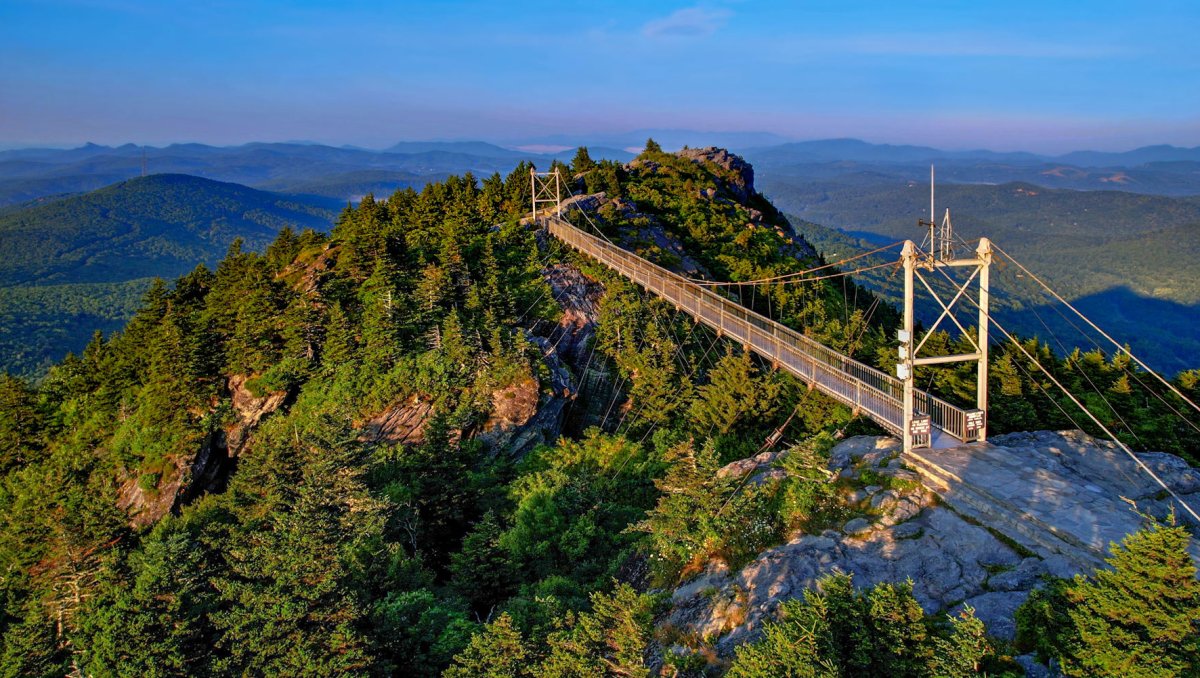 Aerial of Mile High Swinging Bridge and mountaintops and range