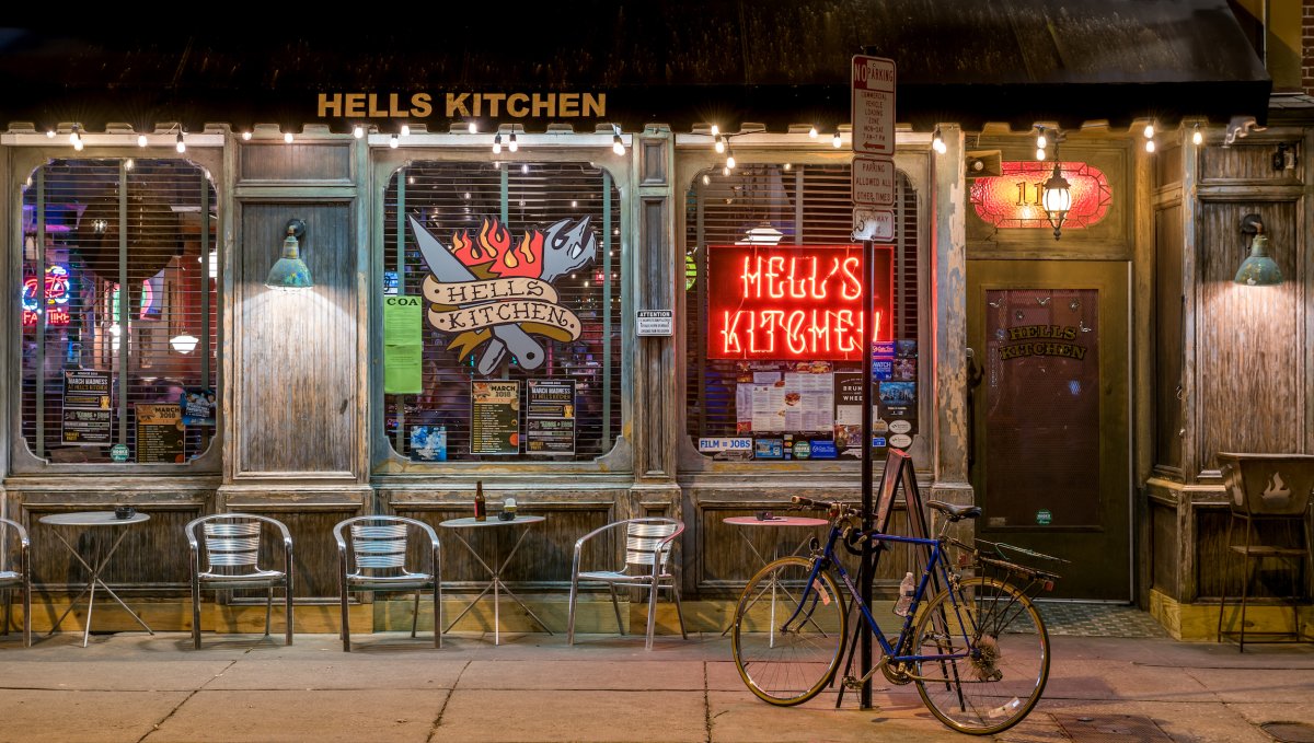 Exterior of Hell's Kitchen at night with bike in front