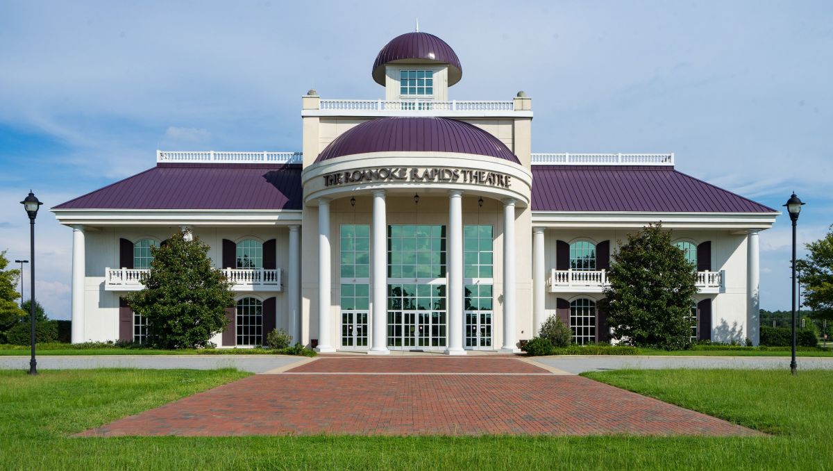 Exterior of Weldon Mills Theatre with purple roof during daytime