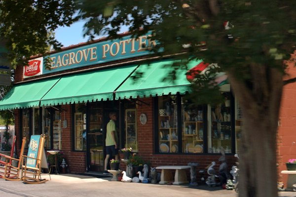 Exterior of Seagrove Pottery store with pottery outside shop