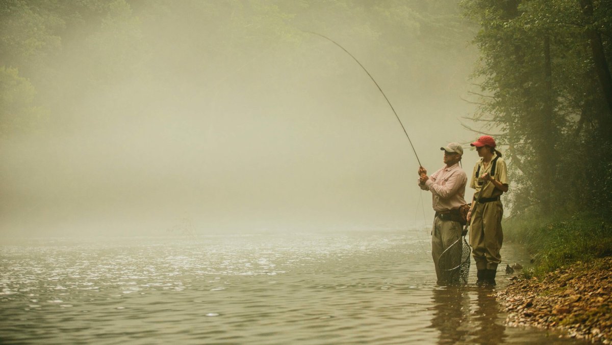 Two men fly-fishing on Watauga River in North Carolina.