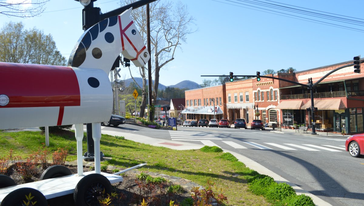 Quaint, downtown Tryon, NC, with local icon wooden horse overlooking street.