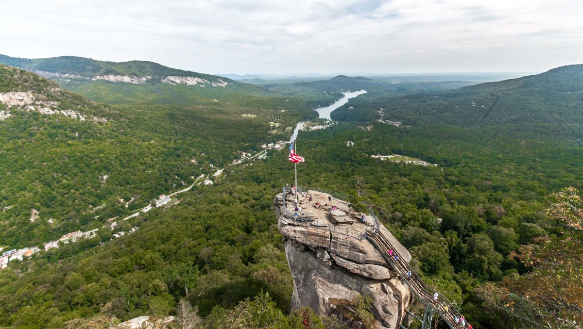 Aerial view of Chimney Rock with river and valley in background on cloudy day