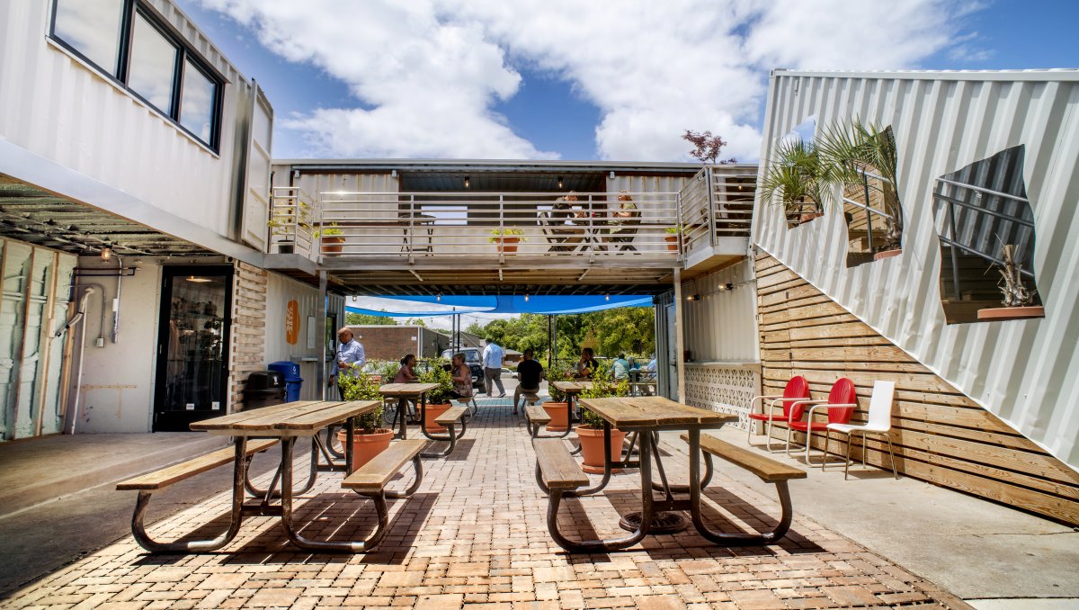 Picnic tables and seating at Cargo District in Wilmington.