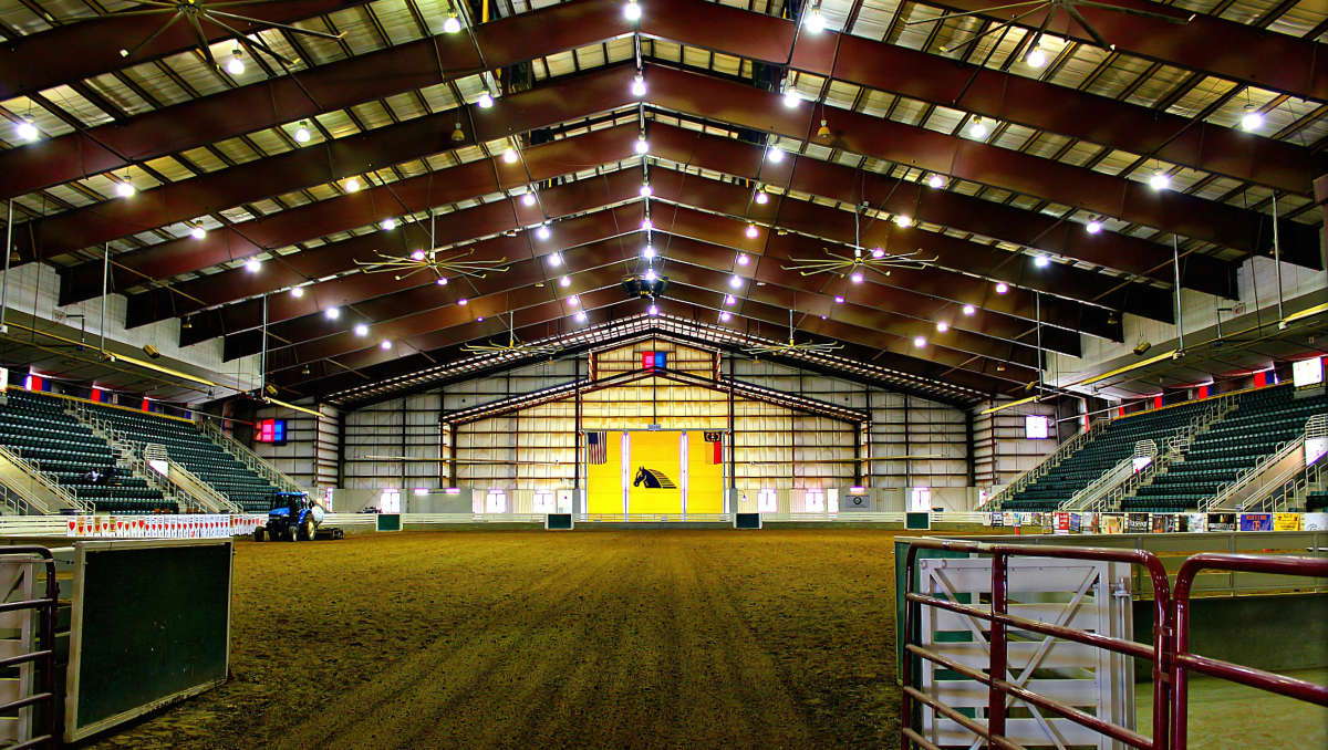 Interior of Senator Bob Martin Eastern Agricultural Center with stands on either side.