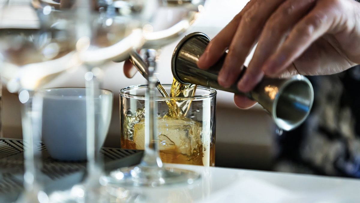 Closeup of cocktail being mixed at bar