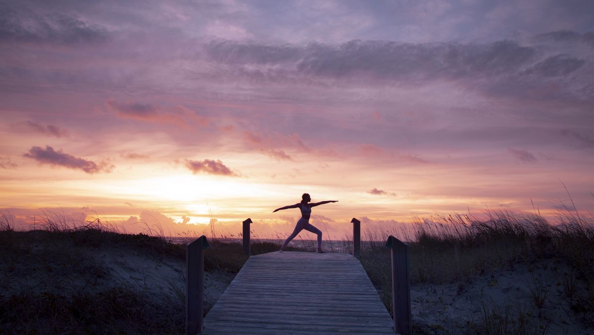 Woman Practicing Yoga Nature Sunrise You Can See Lighthouse Friedrichsort  fotos, imagens de © wirestock_creators #578615224