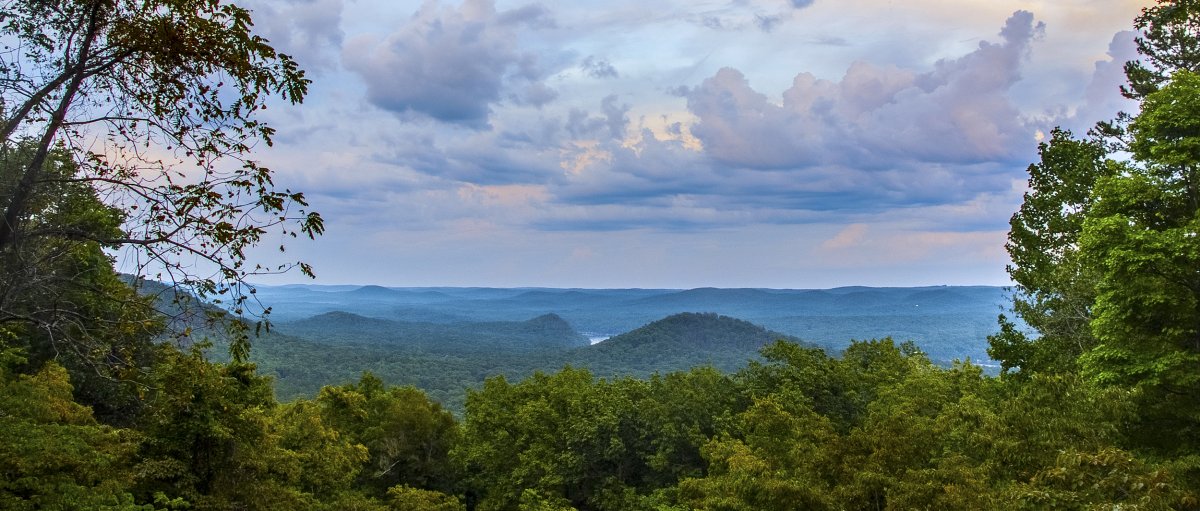 Long-range view of green mountains and blue skies