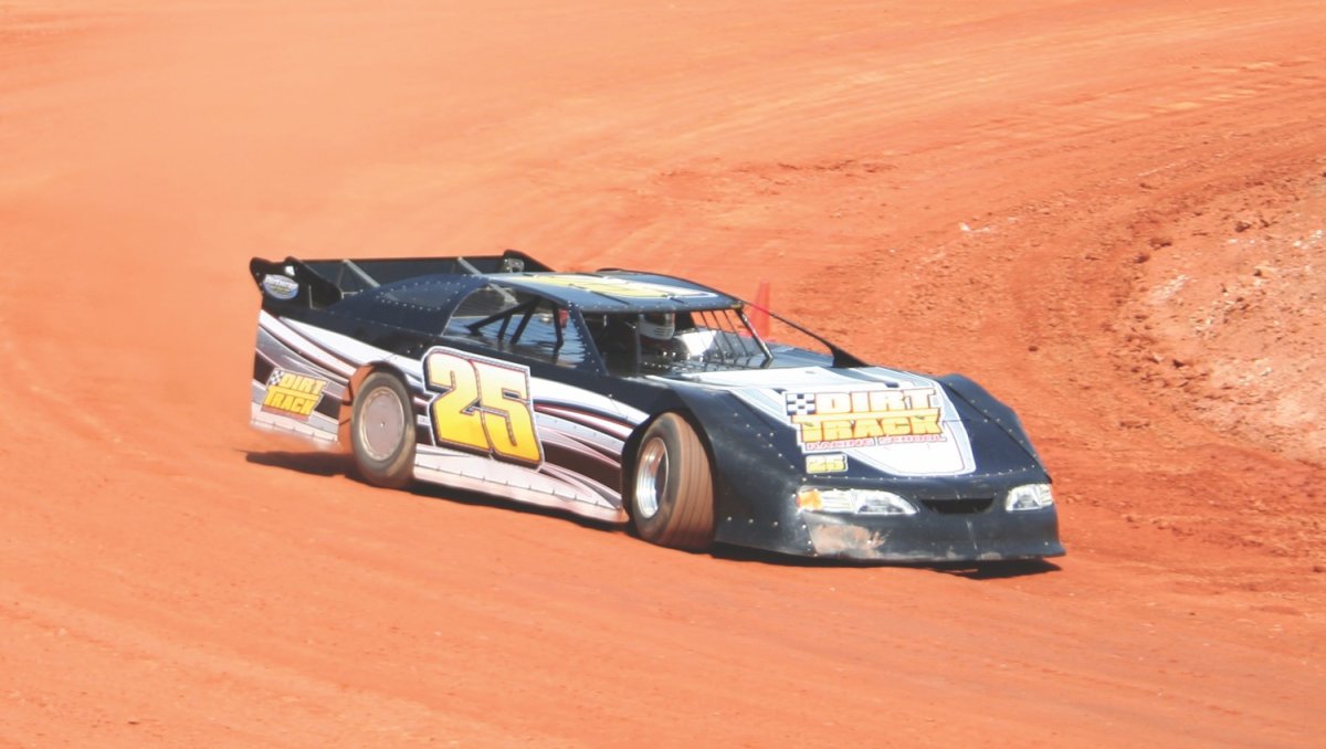 Race car on track at Carolina Speedway during daytime.