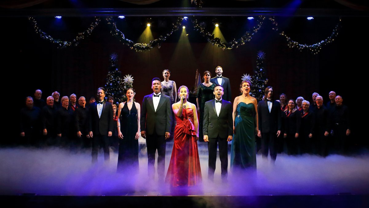 Full stage of singers dressed up performing holiday show at Flat Rock Playhouse.