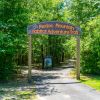 photo of trail entrance with sign - Medoc Mountain Habitat Adventure Trail