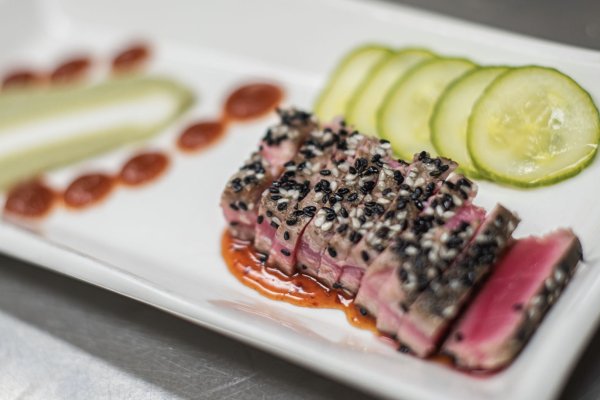Closeup of sesame tuna on artfully crafted plate