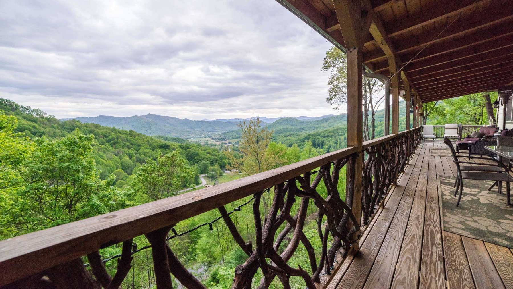 Mountain views off porch of cabin rental during daytime