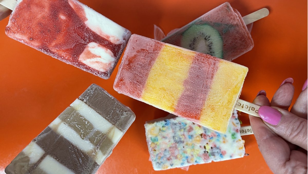 Variety of popsicles over red table