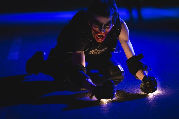 Spooky actor on ground at Scarowinds at Carowinds