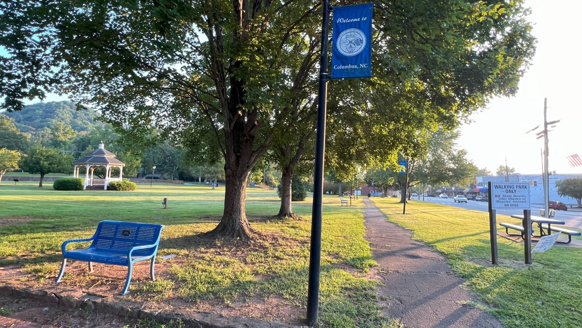 Quiet park and sidewalk in small-town downtown Columbus, NC. 