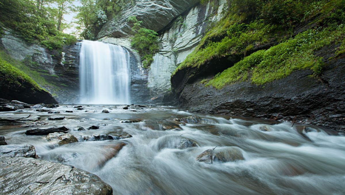 Looking Glass Falls with green moss on rocks