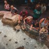 Aerial view of people touching stingrays in touch tank 