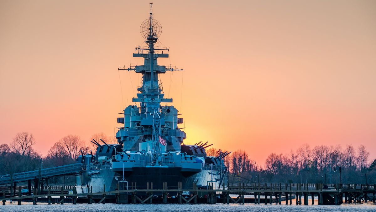 Battleship North Carolina with sunset in background